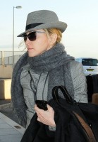 Madonna leaving London, Heathrow Airport, April 12th 2011 (7)