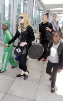 Madonna arrives at Heathrow Airport in London - 19 July 2013 - update (4)