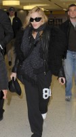 Madonna arrives at JFK airport on her way to London, 21 October 2011 (3)